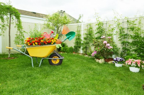 Team of gardeners with tools performing safe garden work